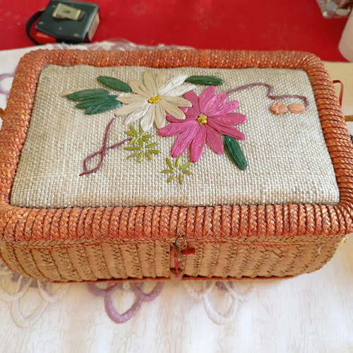Vintage wicker sewing box with floral decoration used