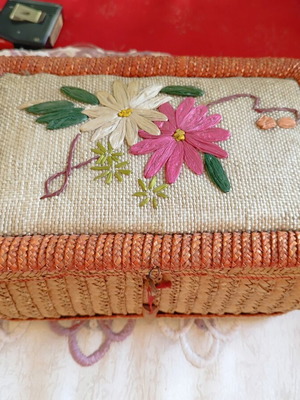 Vintage wicker sewing box with floral decoration used