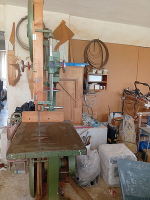 Bandsaw with planer, table, and bench used, includes tools