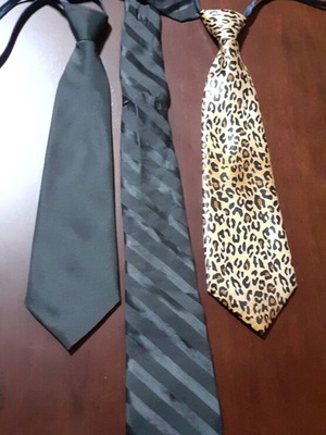 Three women's ties like new, two black and one tiger print