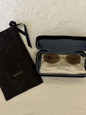 Gucci women's sunglasses GG1802S 005 with gold metal frame and brown lenses new