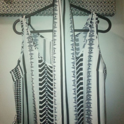 One-piece jumpsuit size S with slanted pockets and belt