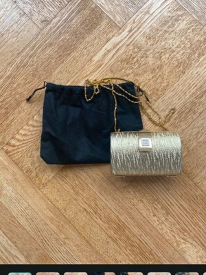 Gold clutch bag with chain strap