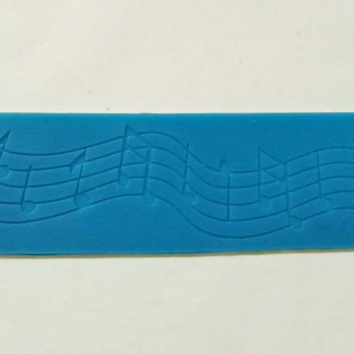 Silicone mold with musical theme pentagram, notes and treble clef like new