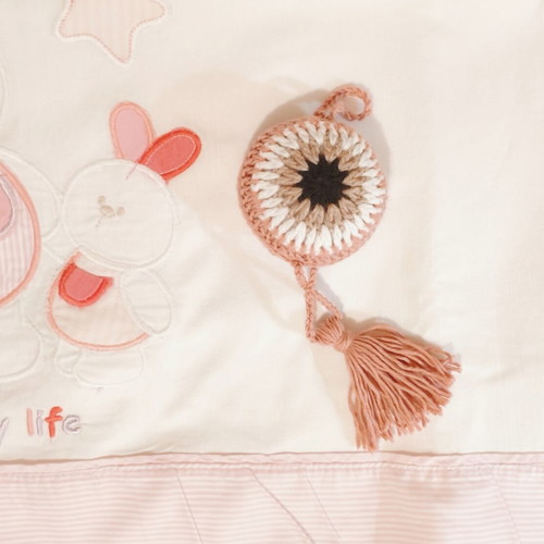 Handmade knitted eye for stroller or cradle, rose color, diameter 8.5 cm