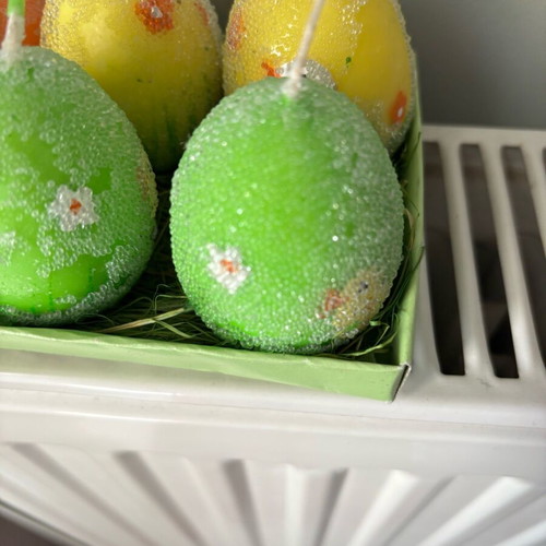 Easter candles shaped like eggs like new, painted