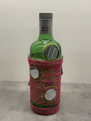 Decorative bottle with mirrors, green glass with fuchsia net