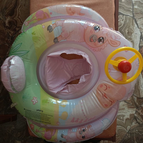 Baby float ring like new with built-in seat and steering wheel toy