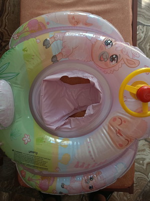 Baby float ring like new with built-in seat and steering wheel toy