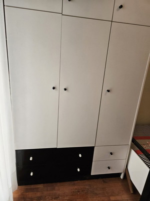 Bedroom wardrobe used with storage spaces, modern design, white doors