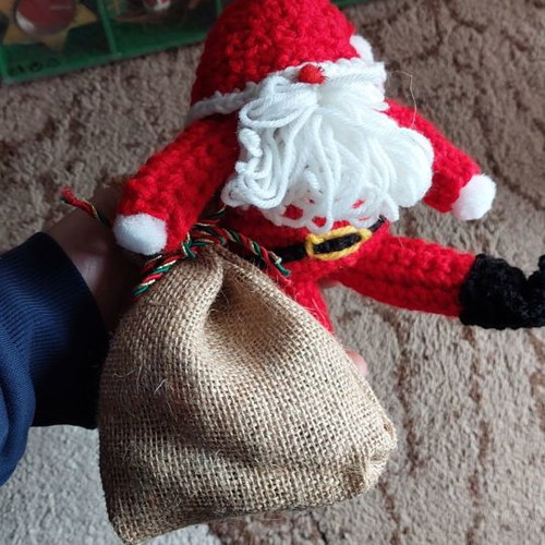 Handmade knitted Santa Claus with candy sack new
