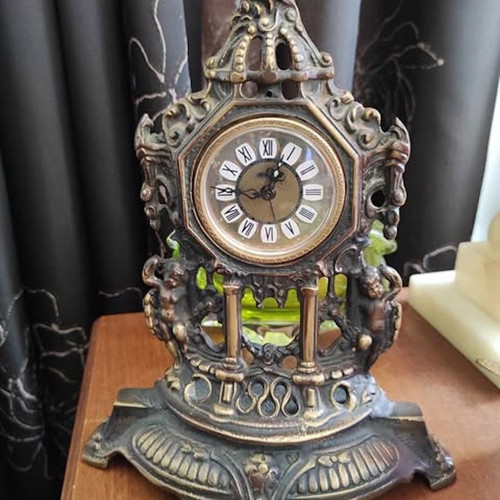 Vintage baroque brass mechanical mantel clock.