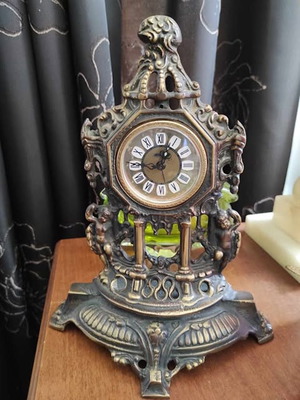 Vintage baroque brass mechanical mantel clock.