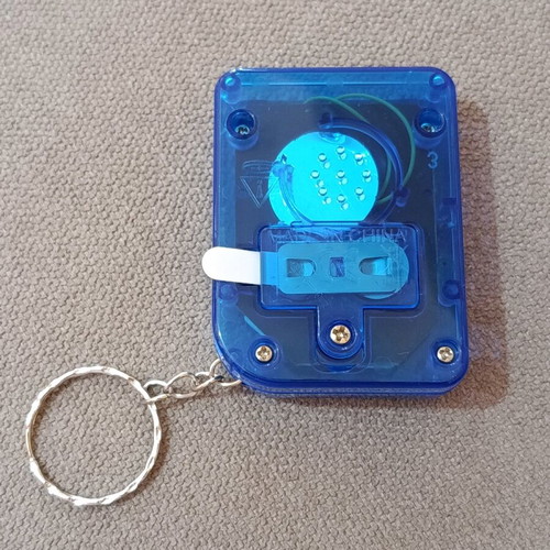 Game console keychain with many Tetris-style games new
