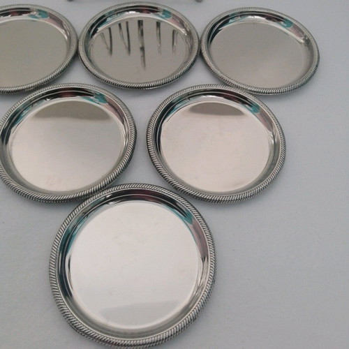 Vintage silver coaster set with elegant stand, like new