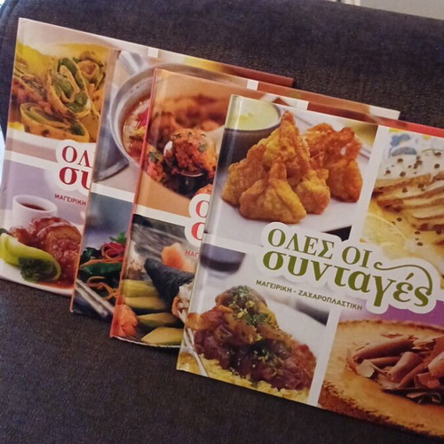 Hardcover cookbooks with recipes from around the world, like new, set of 4