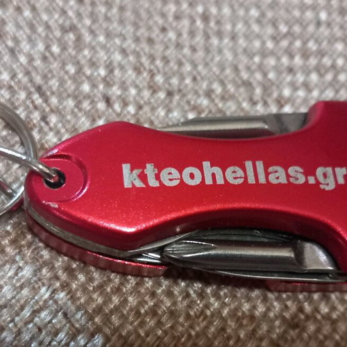 Mini multitool keychain KTEO used with flashlight