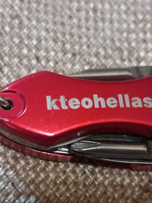 Mini multitool keychain KTEO used with flashlight
