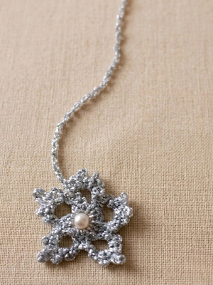 Knitted bookmark snow with pearl and shiny thread