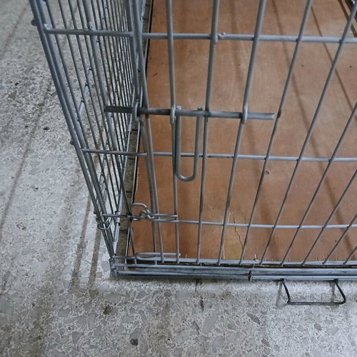 Dog crate like new, metal foldable with sheet base
