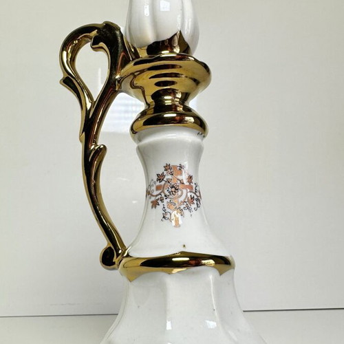 Ceramic candlestick with gold details and floral cross design