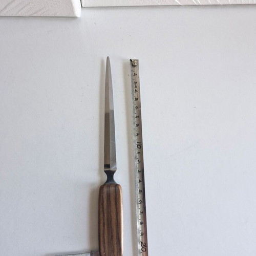 Paper cutter with built-in knife used