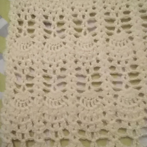 Knitted scarf handmade in soft yellow color with fringes