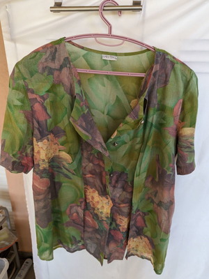 Green shirt with designs used, size L