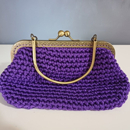 Knitted clutch bag like new, purple with gold details
