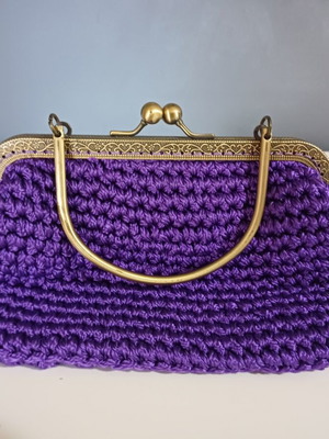 Knitted clutch bag like new, purple with gold details