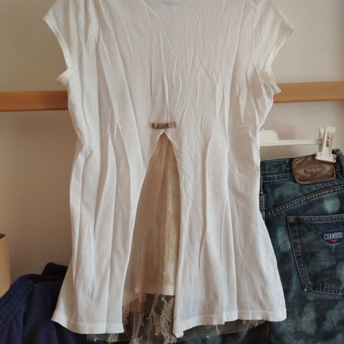 White blouse with lace back and decorative chain, size M