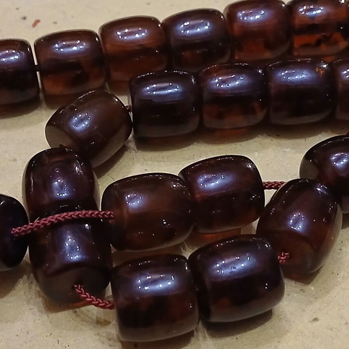 Amber worry beads used with silver elements and tassel