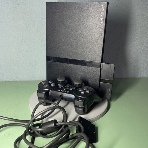 PlayStation 2 console with games