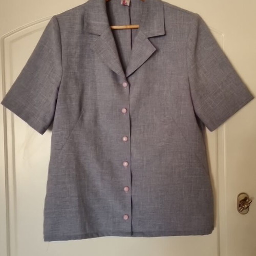 Shirt with shoulder pads like new, short sleeve, loose fit