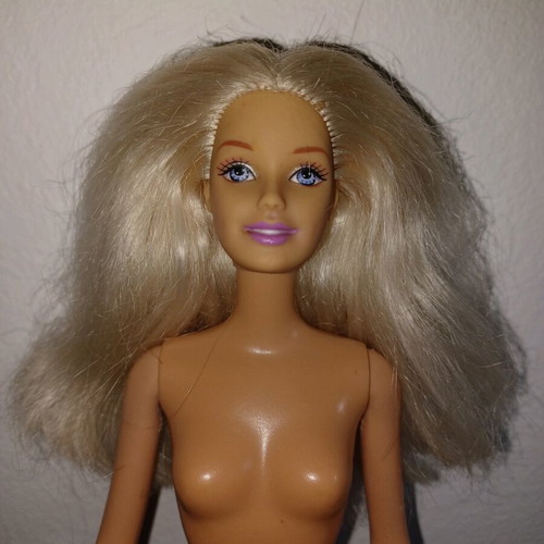 Barbie doll used with mark on knee