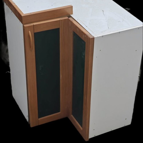 Corner kitchen cabinet used with signs of wear