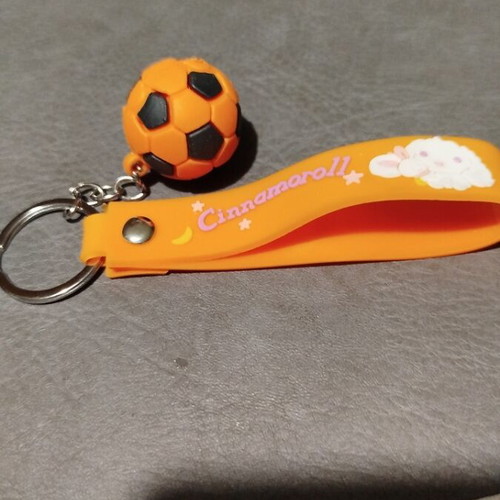 Keychain with orange football ball made of rubber new