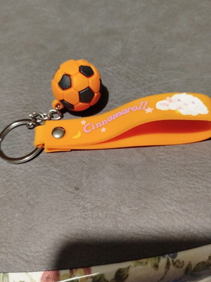 Keychain with orange football ball made of rubber new