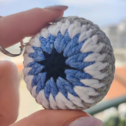 Knitted eye keychain new in gray color