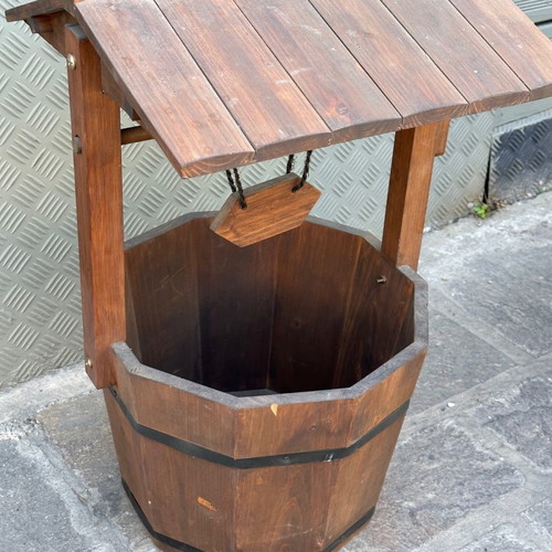Decorative wooden wishing well for planter used