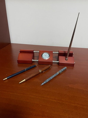 Desk clock set with 4 pens used for office