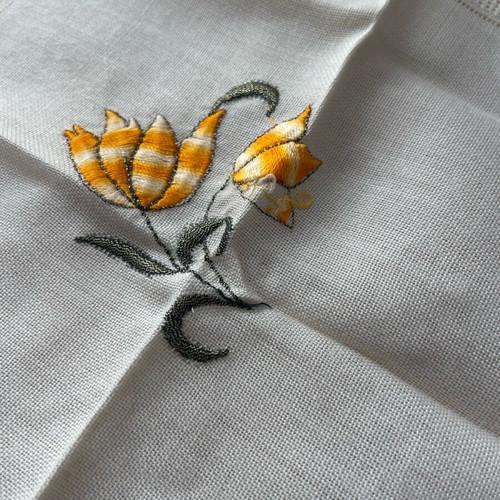 Embroidered doily used with flower design