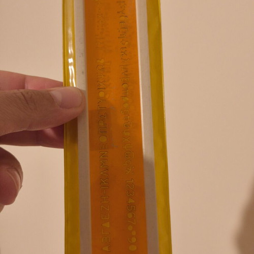 Vintage ruler with letters, symbols and numbers, new in case