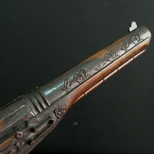 Vintage replica pistol used with engraved designs