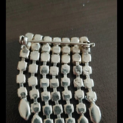 Antique brooch used with colorful stones