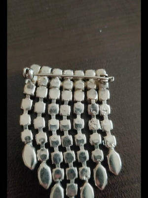 Antique brooch used with colorful stones