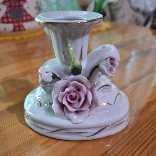 Porcelain candlestick with gilded elements like new