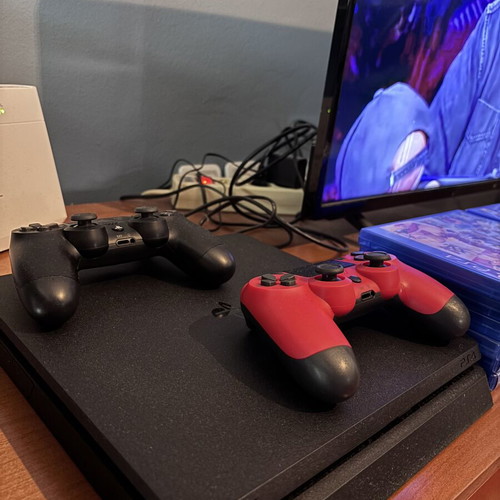 PlayStation 4 console with 16 games and two controllers