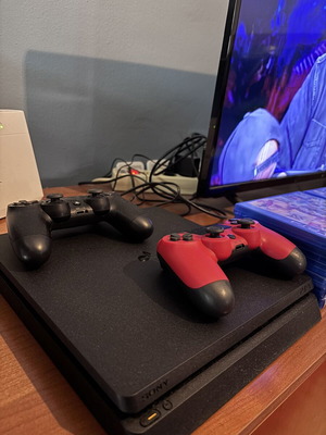 PlayStation 4 console with 16 games and two controllers