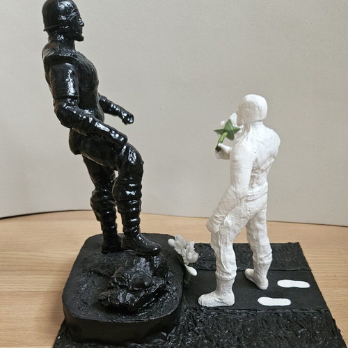 Handmade memorial statue with soldier figure